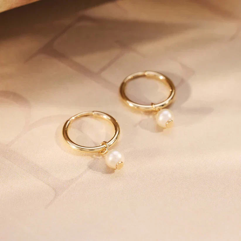 "デリア・クレスト ピアス | 14k ゴールド" can be rewritten as "クレスト ピアス | 14k ゴールド".